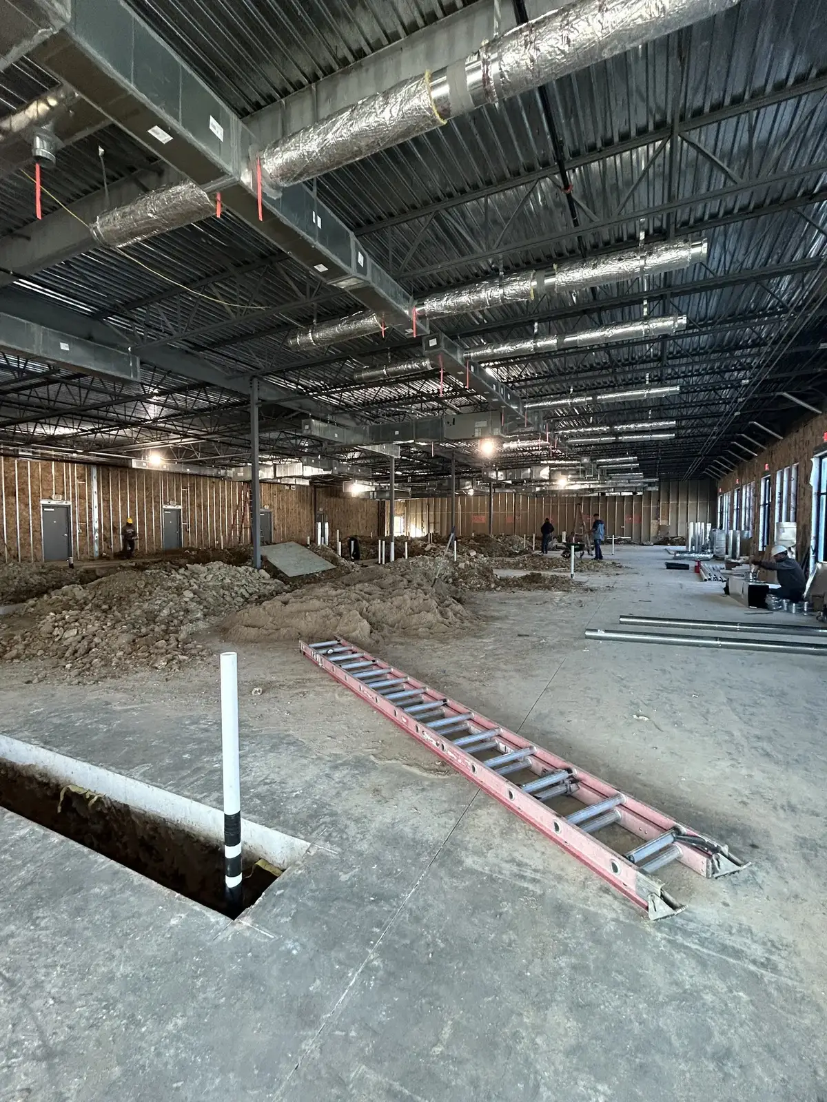 Commercial rough-in: Underground and overhead rough-in during new construction.